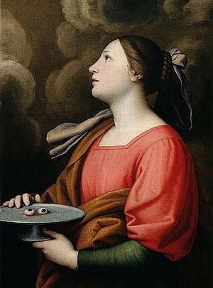 Santa Lucía es una mártir puesto que murió torturada en las persecuciones a los católicos en el Imperio Romano durante el siglo III