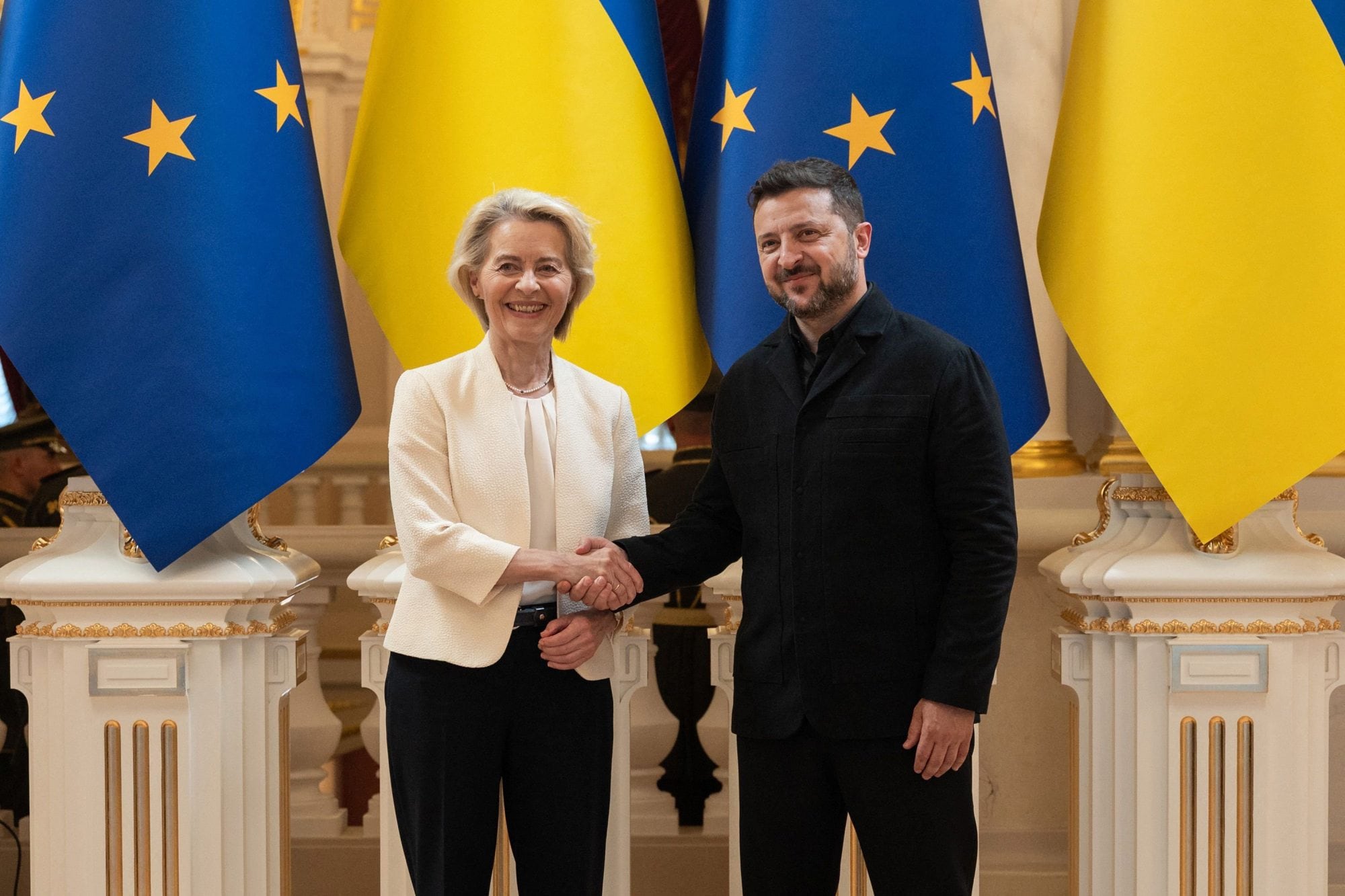 This handout photograph taken and released by the Ukrainian Presidential Press Service on July 15, 2026, shows Ukraine's President Volodymyr Zelensky (R) shaking hands with European Commission President Ursula von der Leyen during their meeting in Kyiv, amid the Russian invasion of Ukraine. (Photo by Handout / UKRAINIAN PRESIDENTIAL PRESS SERVICE / AFP) / RESTRICTED TO EDITORIAL USE - MANDATORY CREDIT