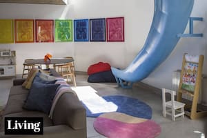 Con un tobogán en el living y mucho color, una antigua casa-taller fue transformada en vivienda familiar