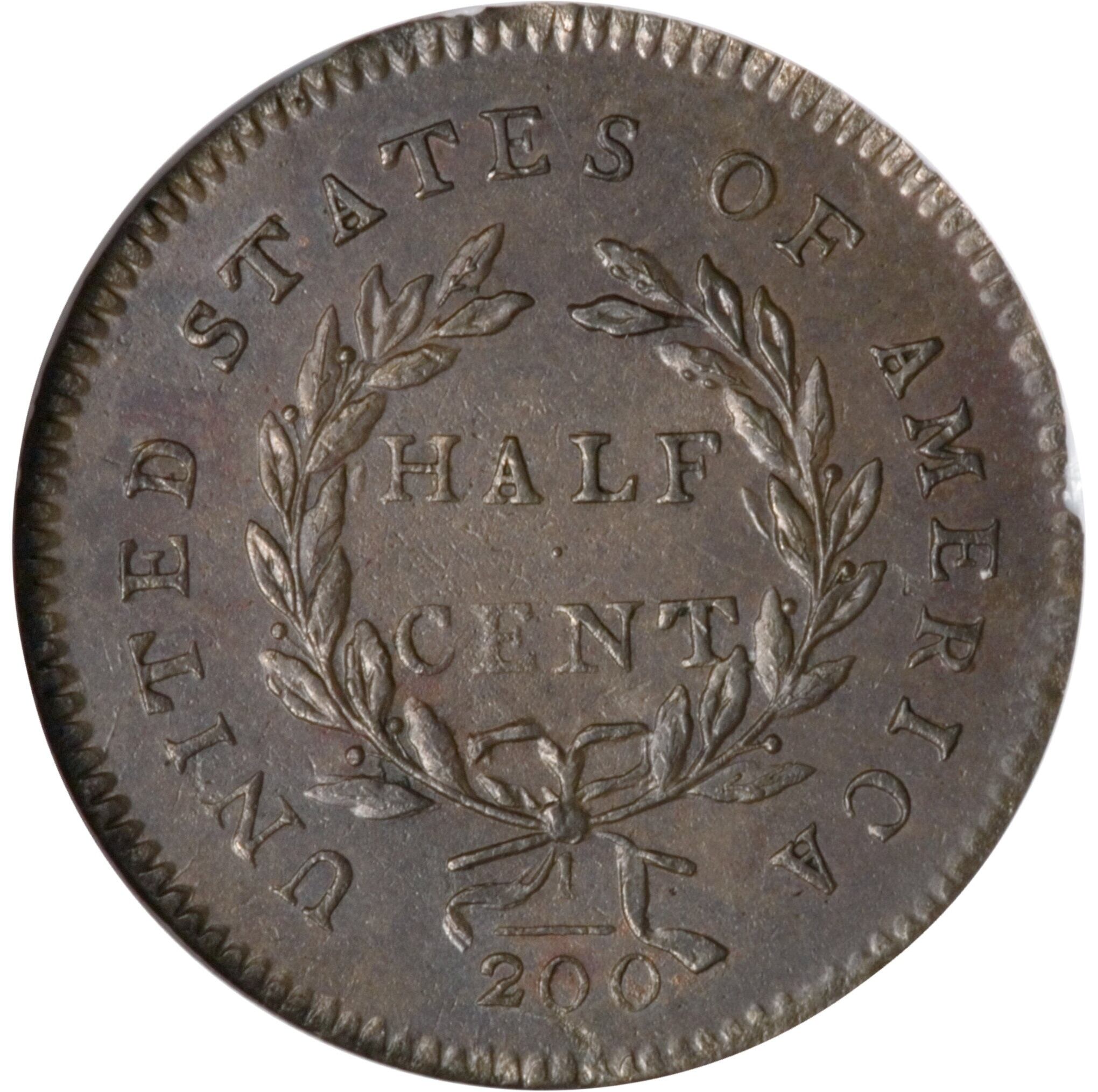 El reverso de esta moneda muestra cinco bayas en la rama izquierda de la corona y cuatro en la derecha