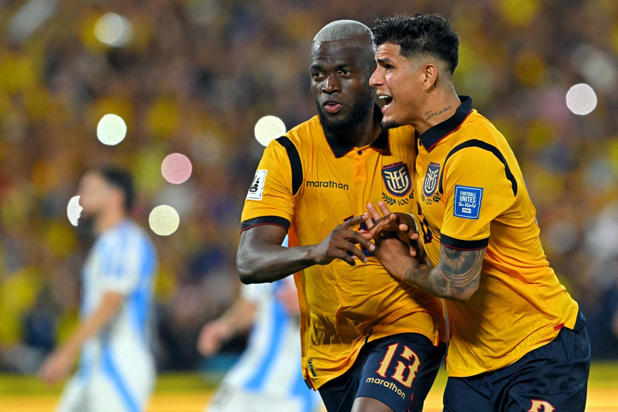 Ecuador's forward #13 Enner Valencia (L) celebrates with teammate defender #03 Piero Hincapie (R) after scoring his team's first goal during the 2026 FIFA World Cup South American qualifiers football match between Ecuador and Argentina at the Monumental Banco Pichincha Stadium in Guayaquil, Ecuador on September 9, 2025. (Photo by Rodrigo BUENDIA / AFP)