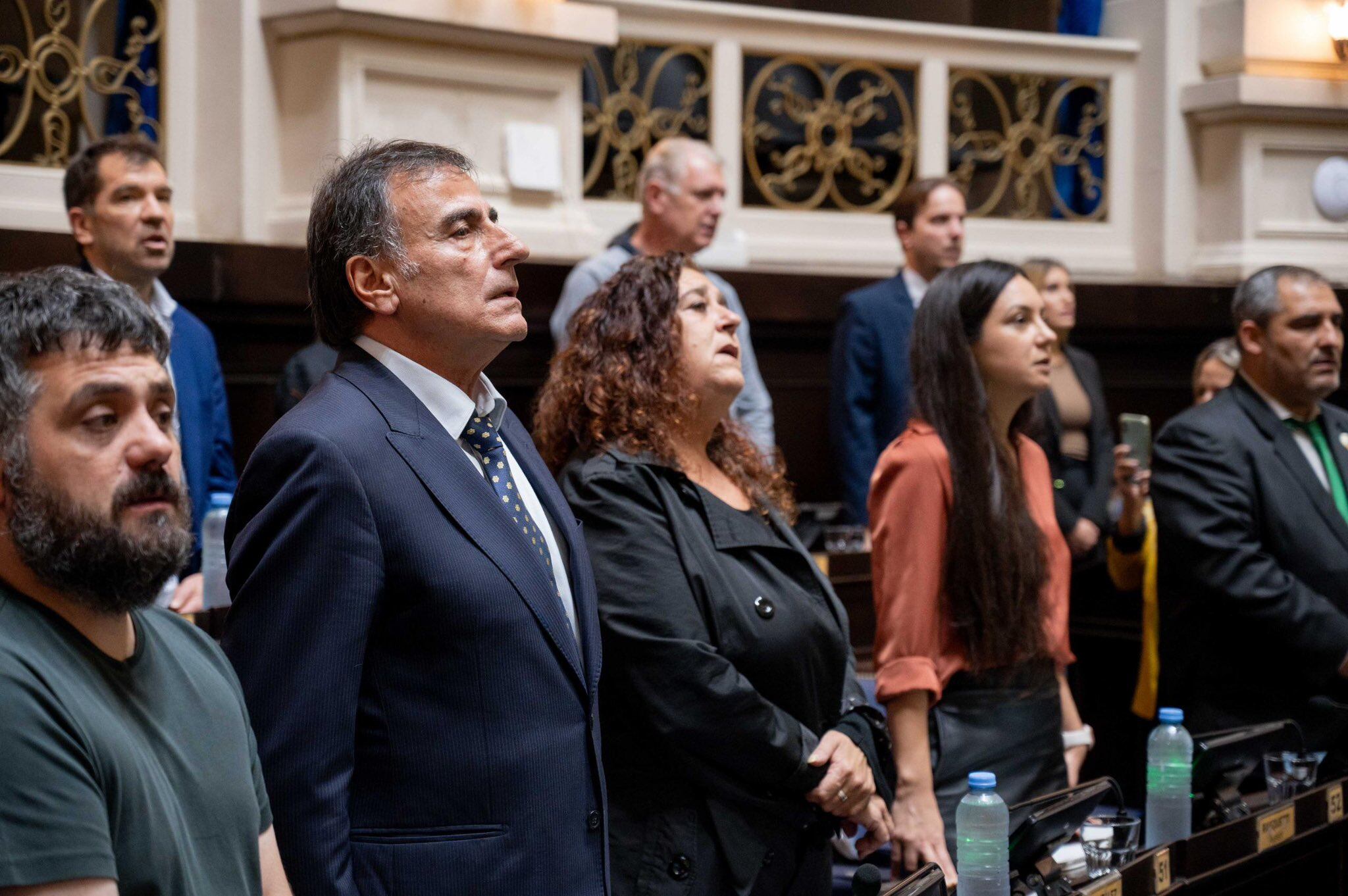 Eslaiman, con Tignanelli a su derecha y González, a su izquierda