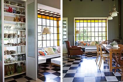 A la izq., un armario con fondo espejado donde la vajilla inglesa se refleja. La bay window de hierro y vidrio también es diseño de la arquitecta, diseñadora y dueña de casa Natalia Géci: el borde en amarillo le suma un cálido filtro a la luz natural.
