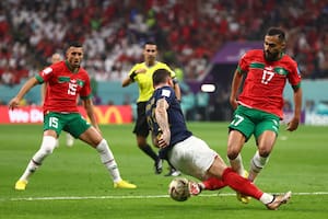 AL KHOR, QATAR - DECEMBER 14: Theo Hernandez of France competes with Sofiane Boufal of Morocco during the FIFA World Cup Qatar 2022 semi final match between France and Morocco at Al Bayt Stadium on December 14, 2022 in Al Khor, Qatar. (Photo by Chris Brunskill/Fantasista/Getty Images)