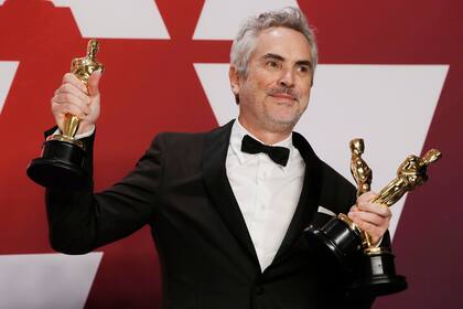 Alfonso Cuarón con sus tres premios