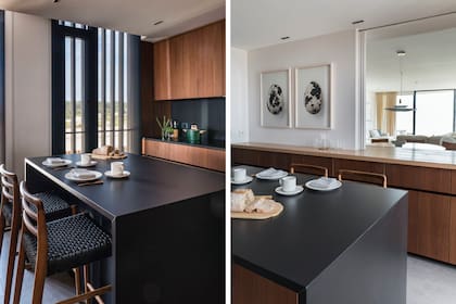 Amoblamiento con frentes enchapados en nogal y mesadas en Dekton negro. La isla se intervino calando un nicho para las banquetas (Coin Vert). Fotografías enmarcadas de Vicky Aguirre.
