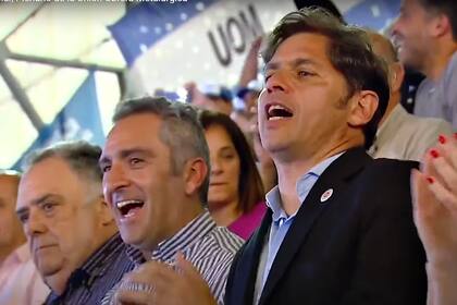 Andrés Larroque junto a Axel Kicillof