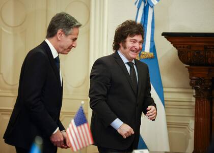Argentina's President Javier Milei (R) walks with US Secretary of State Antony Blinken during a meeting at the Casa Rosada Presidential Palace, in Buenos Aires on February 23, 2024. (Photo by AGUSTIN MARCARIAN / POOL / AFP)