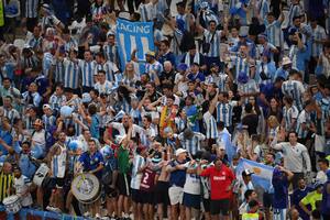 Argentina fans cheer prior to the Qatar 2022 World Cup quarter-final football match between The Netherlands and Argentina at Lusail Stadium, north of Doha on December 9, 2022. (Photo by FRANCK FIFE / AFP)