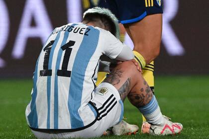 Argentina's forward #11 Yamila Rodriguez reacts in frustration on the ground after the end of the Australia and New Zealand 2023 Women's World Cup Group G football match between Argentina and Sweden at Waikato Stadium in Hamilton on August 2, 2023. (Photo by Saeed KHAN / AFP)