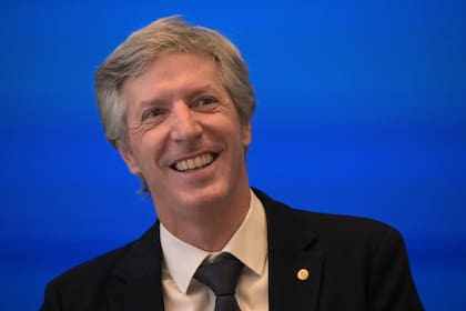 Argentina’s Central Bank president Santiago Bausili gives a press conference at the Central Bank headquarters in Buenos Aires on December 15, 2025. Argentina will adjust exchange rate bands in line with inflation. (Photo by Juan MABROMATA / AFP)