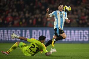 Argentina's forward #09 Julian Alvarez kicks the ball to score past Chile's goalkeeper #23 Brayan Cortes during the 2026 FIFA World Cup South American qualifiers football match between Chile and Argentina at the Nacional Julio Mart�nez Pradanos stadium in Santiago, on June 5, 2025. (Photo by Rodrigo ARANGUA / AFP)