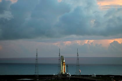 The NASA moon rocket stands ready at sunrise on Pad 39B before the Artemis 1 mission to orbit the moon at the Kennedy Space Center, Monday, Aug. 29, 2022, in Cape Canaveral, Fla. (Joel Kowsky/NASA via AP)