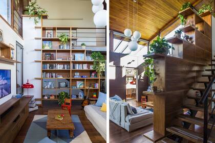 Biblioteca con estantes en voladizo que estiran sus límites con sutileza. Lámpara de mesa roja (Juan Diciervo).