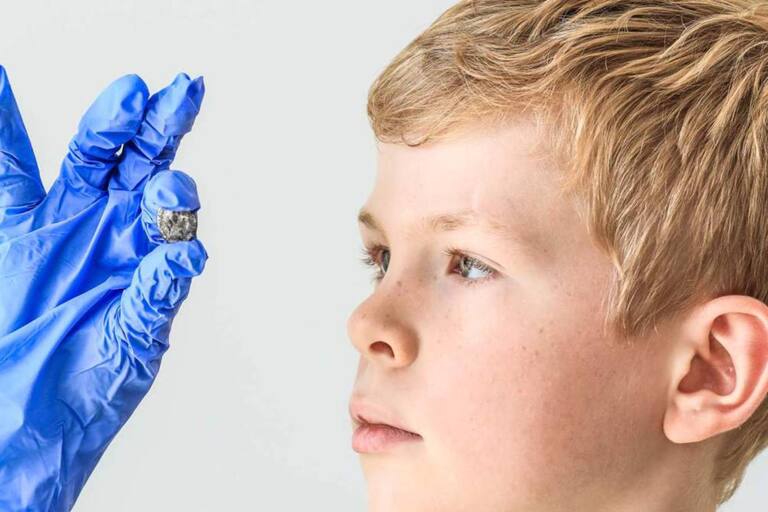 While playing at school, he found an 1800-year-old coin