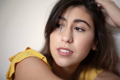 Body (Mishka, $1560), jean y botas de Renata.