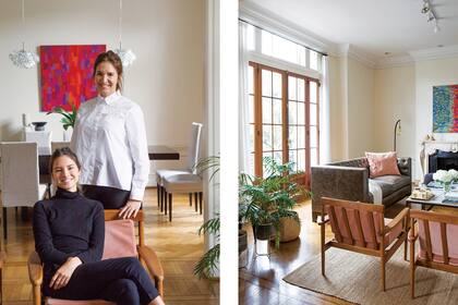 Carina y su hija Clara, frente al comedor presidido por el cuadro de Daniel Chiocchini y un dúo de luminarias hechas íntegramente de cristal rescatadas de la baulera de una amiga.
