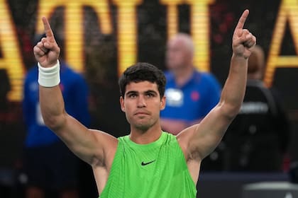 Carlos Alcaraz of Spain celebrates after defeating Alexander Zverev of Germany in their semifinal match at the Australian Open tennis championship in Melbourne, Australia, Friday, Jan. 30, 2026. (AP Photo/Dita Alangkara)