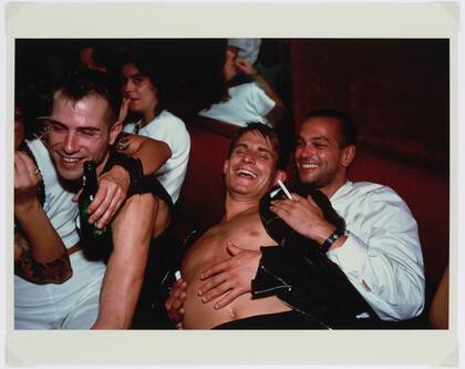 Clemens, Jens and Nicolas Laughing at Le Pulp, Paris, por Nan Goldin
