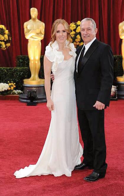 Con su marido, Gary Magness, en la entrega de los premios Oscar, en 2010, a donde fueron a acompañar a Precious, film que produjeron y que ganó dos estatuillas. 