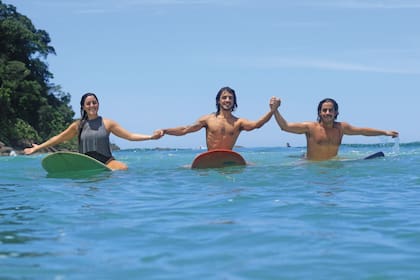 Con sus hermanos, Máximo y Michel.