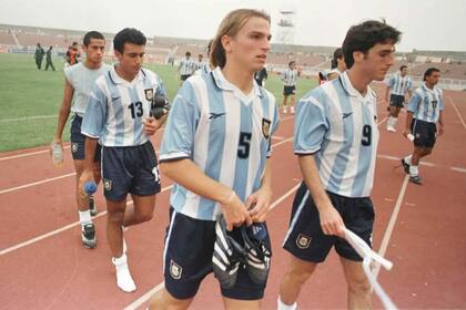 Cuchu Cambiasso, Peralta y Javier Villarreal, tras uno de los encuentros en suelo africano