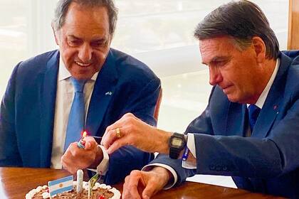 Daniel Scioli y Jair Bolsonaro, en el "festejo" por el año del exgobernador a Brasil