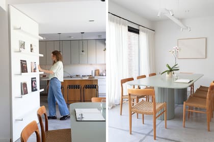 Detrás de este panel rebatible –con estantes para libros– está el bajoescalera, donde crearon un espacio de guardado. En el comedor, mesa (Ideï Arquitectura) con tapa de Silestone ‘Posidonia Green’ (Marmolería Cervaiole) y lámpara de techo (Huup).