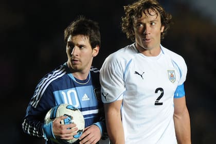 Lionel Messi y Diego Lugano