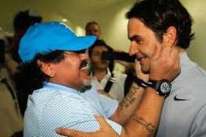 Diego toma de los cachetes a Roger en Dubai 2013; es una de las fotos favoritas de Federer