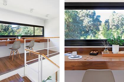 Un gran tablero horizontal de madera con cajones en los extremos y sillas ‘Eames’ (Quamo) arman el estudio que balconea sobre el living, pero mira a las copas verdes.