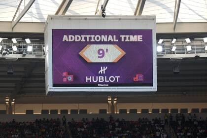 DOHA, QATAR - NOVEMBER 25: The LED board shows nine minutes of additional time before the end of the second half during the FIFA World Cup Qatar 2022 Group B match between Wales and IR Iran at Ahmad Bin Ali Stadium on November 25, 2022 in Doha, Qatar. (Photo by Matthias Hangst/Getty Images)