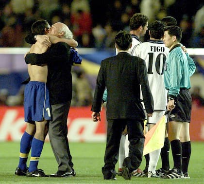 The hug between Juan Roman Riquelme and Bianchi while Figo tries to protest in front of Colombian referee Ruiz