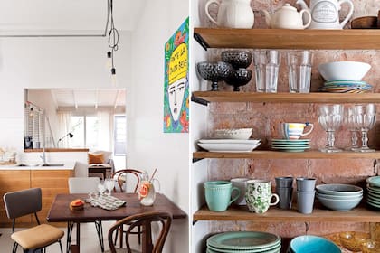 Mesa antigua de madera maciza y sillas vintage, acompañadas por una obra de Guille Pachelo. El acceso al cuarto principal desde la cocina se cerró con un muro de ladrillo. En la superficie ganada se armó una estantería.