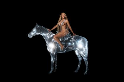 El arte de su anterior álbum mostraba a la cantante montando un caballo holográfico plateado