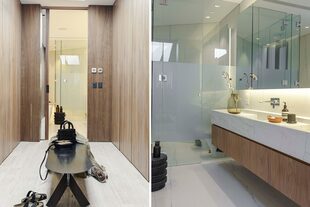 El baño en suite y el vestidor mantienen la impronta: líneas simples, materiales clásicos y contundentes. Debajo de la lucarna que ilumina el vestidor, banco ‘Iron’ y throw de lino rústico paquistaní (Estudio Pet).