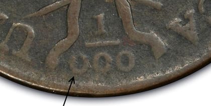 El error se encuentra en la parte inferior del reverso de la moneda