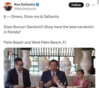 El gobernador Ron DeSantis posa junto al personal de Buccan Sandwich Shop durante la grabación de un nuevo episodio de su serie sobre gastronomía local en Palm Beach