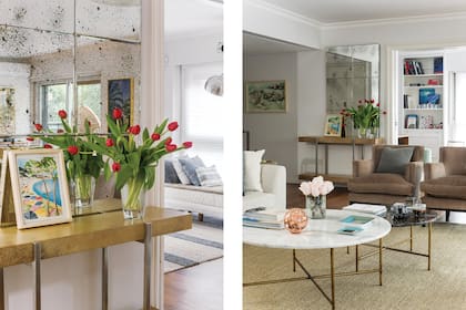 El hall de entrada con consola y espejo (Duveen), arreglo (Nequifloreale) y cuadro 'Un verano alemán' de Lu Garabello.