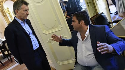 El ministro de Trabajo, Jorge Triaca junto al presidente Mauricio Macri