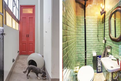 El pasillo con nuevo piso de cemento alisado. Detrás de la puerta roja se encuentra el toilette.