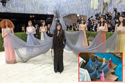 El paso de Madonna por la red carpet fue digno de uno de sus shows. Un halo de misterio envolvió su diseño de Saint Laurent inspirado
en una pintura de Leonora Carrington, que remató con un llamativo tocado con gran velo que llevaron entre seis asistentes