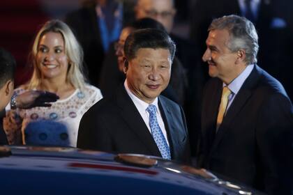 El presidente chino Xi Jinping junto al ministro Aguad