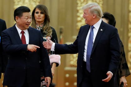 El presidente de China, Xi Jinping, y su par estadounidense Donald Trump, durante un encuentro en Pekín, el mes pasado