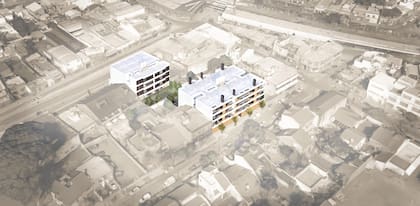 El proyecto consiste en dos edificios de departamentos de tres pisos cada uno, con unidades de 1 y 2 ambientes, conectados por un área verde central