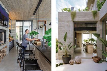 El sector de la parrilla tiene cortinas de madera negra (Solset), lámparas colgantes, banquetas altas (Negro) y salida a un patio interno. Los pisos son de cemento alisado.