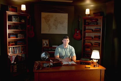 - EMBARGO: NO ELECTRONIC DISTRIBUTION, WEB POSTING OR STREET SALES BEFORE 5:01 A.M. ET ON SUNDAY, APRIL 5, 2026. NO EXCEPTIONS FOR ANY REASONS - Blake Musick, a pharmacist, with some of his Bible collection in the study of his home outside Johnson City, Tenn. on Thursday, April 2, 2026. Musick is among a growing number of Americans buying high-end - and high-priced - copies of the Bible. "If it's something that important, then why not have a really nice copy of it?" (Mike Belleme/The New York Times)