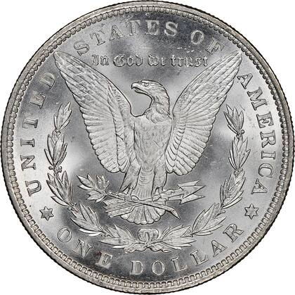 En el reverso, el diseño del dólar Morgan presenta un águila calva con las alas extendidas, sosteniendo flechas y una rama de olivo, símbolos de guerra y paz