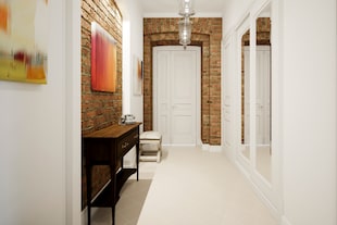 En este corredor se recurrió a ladrillos a la vista para diferenciar de los demás ambientes y agregar textura