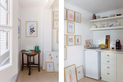 En la cocina, se aprovecharon paredes y estantes para exhibir obra enmarcada. En la repisa superior, vajilla de gres (Huella) y a un costado, jarra verde (Fundación Taller Los Naranjos).